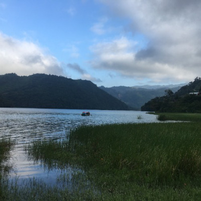 View of the lake with kayak on the horizon